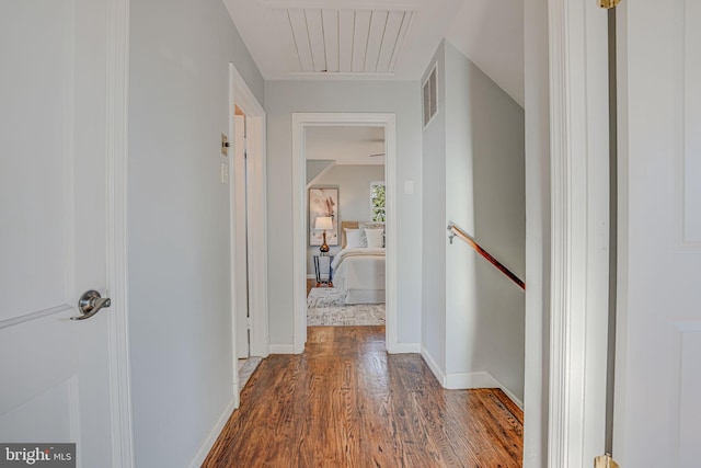 corridor with wood-type flooring