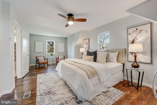 bedroom with ceiling fan and dark hardwood / wood-style flooring