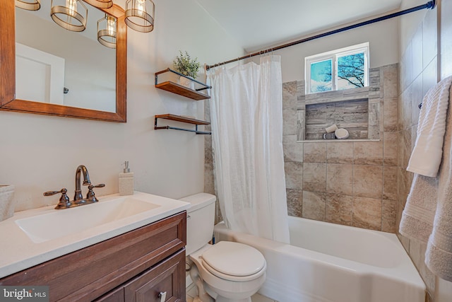 full bathroom with an inviting chandelier, vanity, shower / bath combination with curtain, and toilet