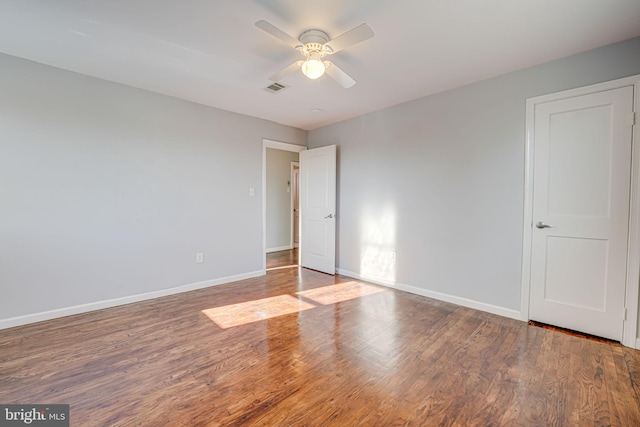 spare room featuring hardwood / wood-style flooring and ceiling fan