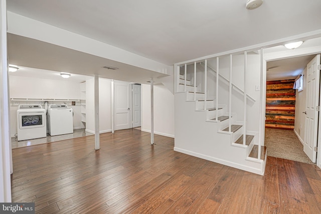 basement with washer and dryer and wood-type flooring