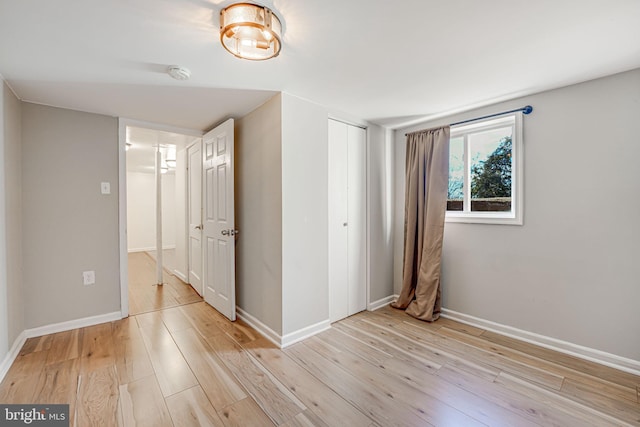 spare room featuring light hardwood / wood-style floors