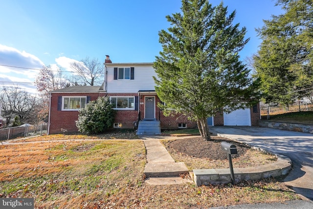 view of front of property with a garage