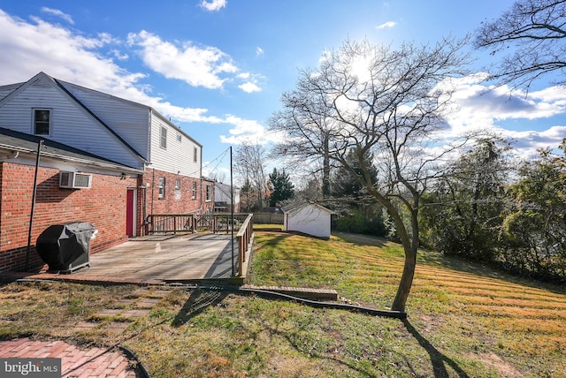 view of yard with a shed and a wooden deck