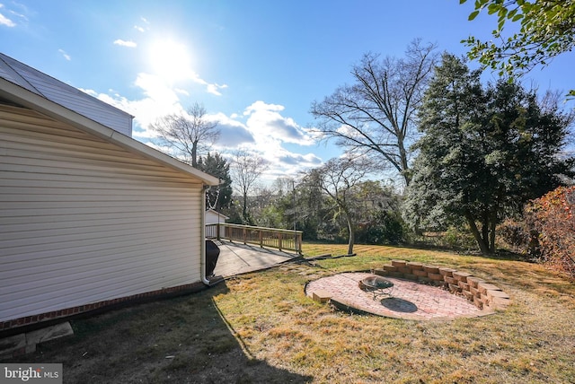 view of yard with a wooden deck