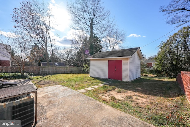 view of yard with a storage shed and a patio area