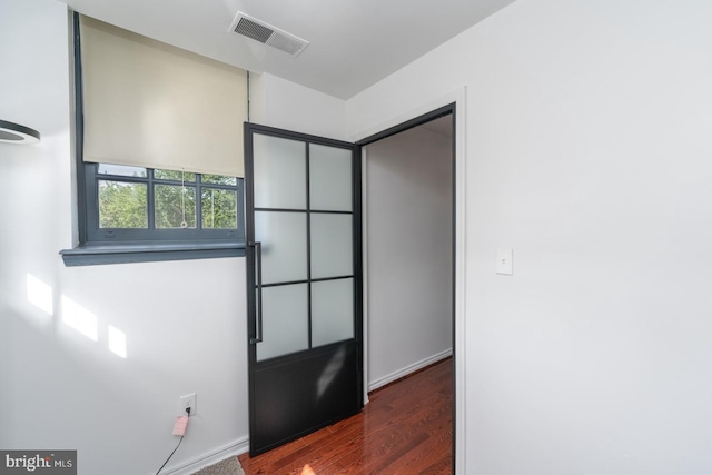 foyer with dark wood-type flooring