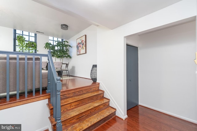 stairway featuring hardwood / wood-style flooring