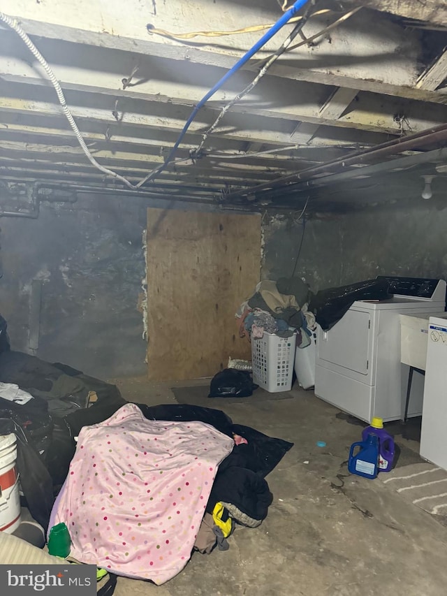 basement with washer and dryer and sink