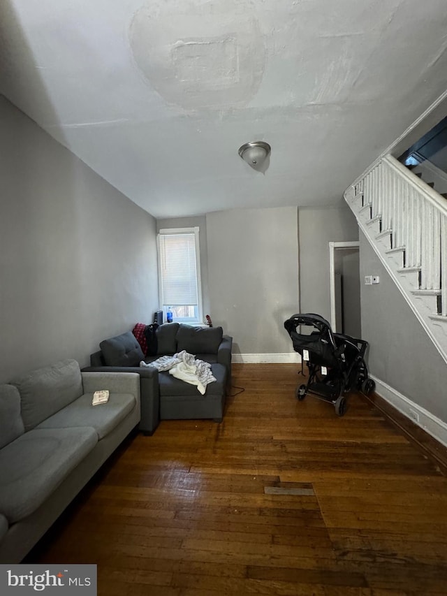 living room with dark hardwood / wood-style floors