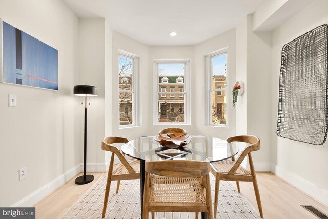 dining area with light hardwood / wood-style flooring