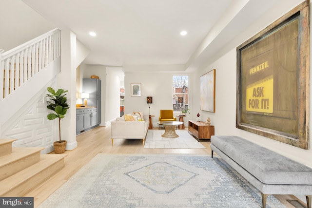 living room with light hardwood / wood-style flooring