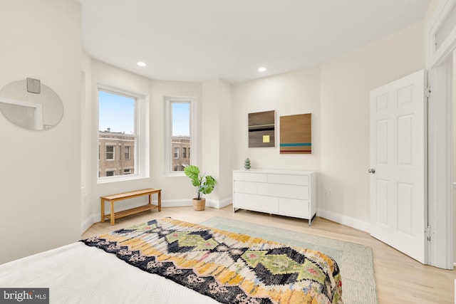 bedroom with hardwood / wood-style floors