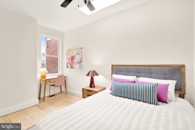 bedroom featuring hardwood / wood-style flooring and ceiling fan