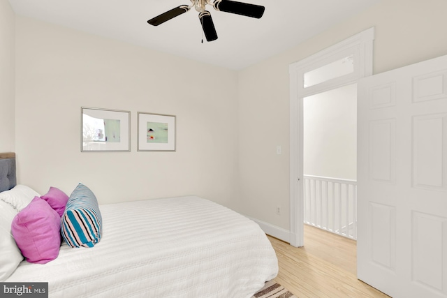 bedroom with ceiling fan and light wood-type flooring