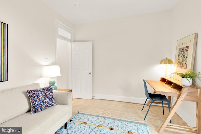 office area with hardwood / wood-style floors