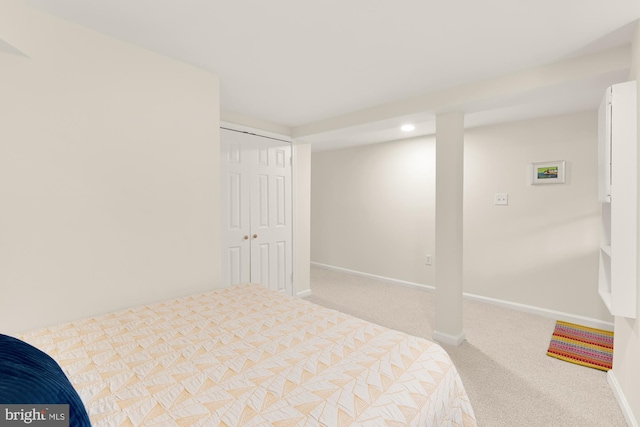 carpeted bedroom featuring a closet