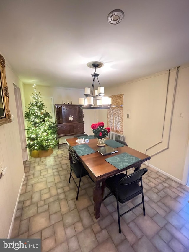 dining area featuring a notable chandelier