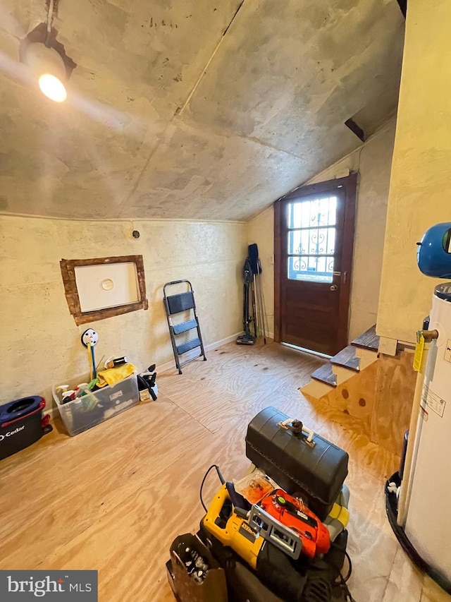 workout room featuring lofted ceiling