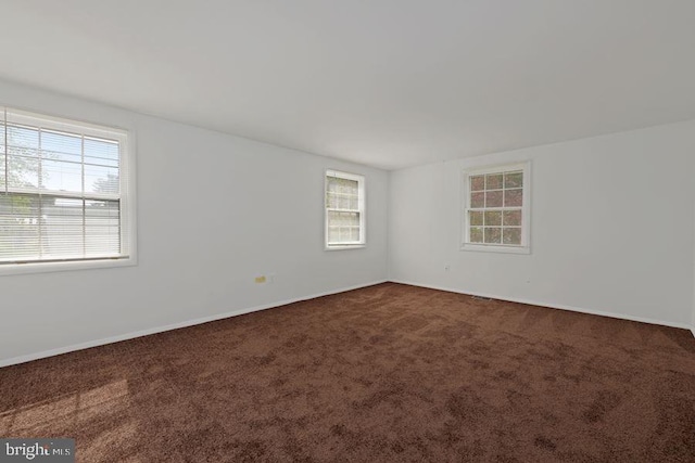 spare room featuring carpet floors