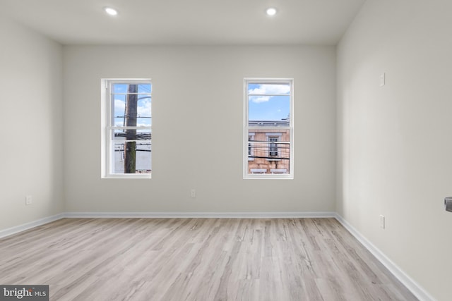 empty room with light wood-type flooring