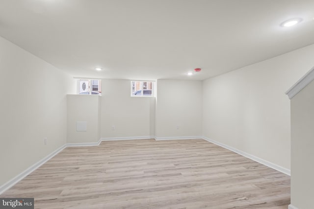 basement featuring light wood-type flooring