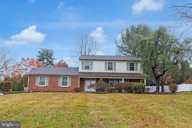 view of property featuring a front lawn