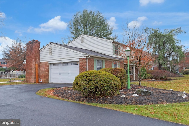 view of side of home with a garage