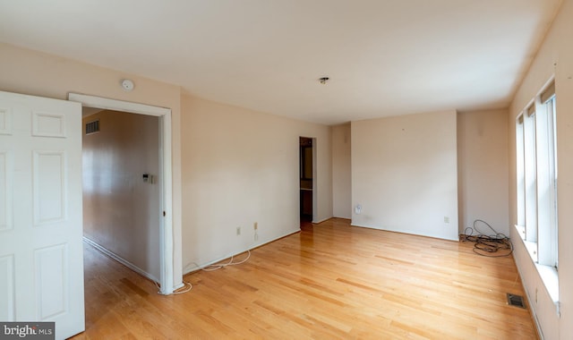 empty room with light wood-type flooring