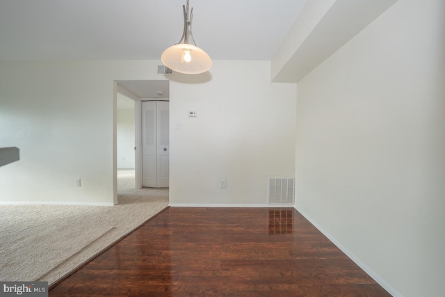 unfurnished room featuring dark hardwood / wood-style flooring