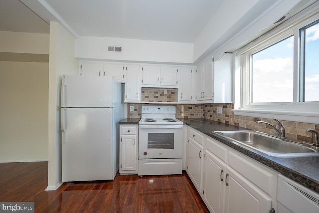 kitchen featuring dark hardwood / wood-style flooring, white appliances, white cabinetry, and sink