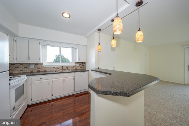 kitchen featuring white cabinets, white appliances, hanging light fixtures, and sink