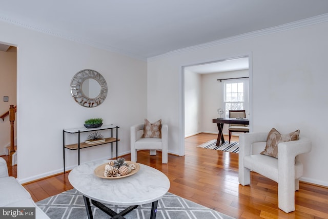 sitting room with wood-type flooring