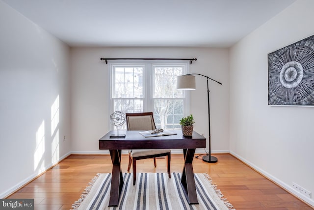 office space with light wood-type flooring