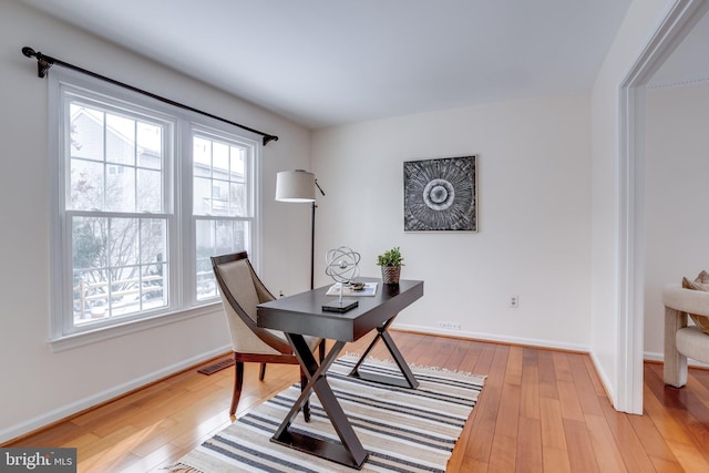 home office featuring light hardwood / wood-style floors