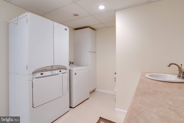 laundry area featuring washer and clothes dryer and sink