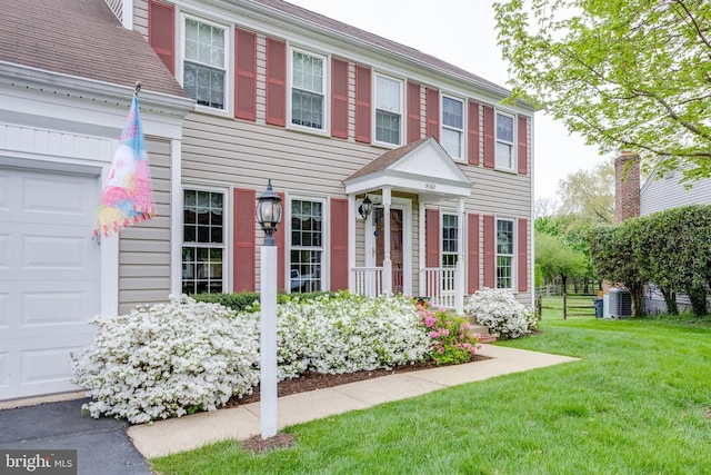 view of front facade with central AC and a front lawn