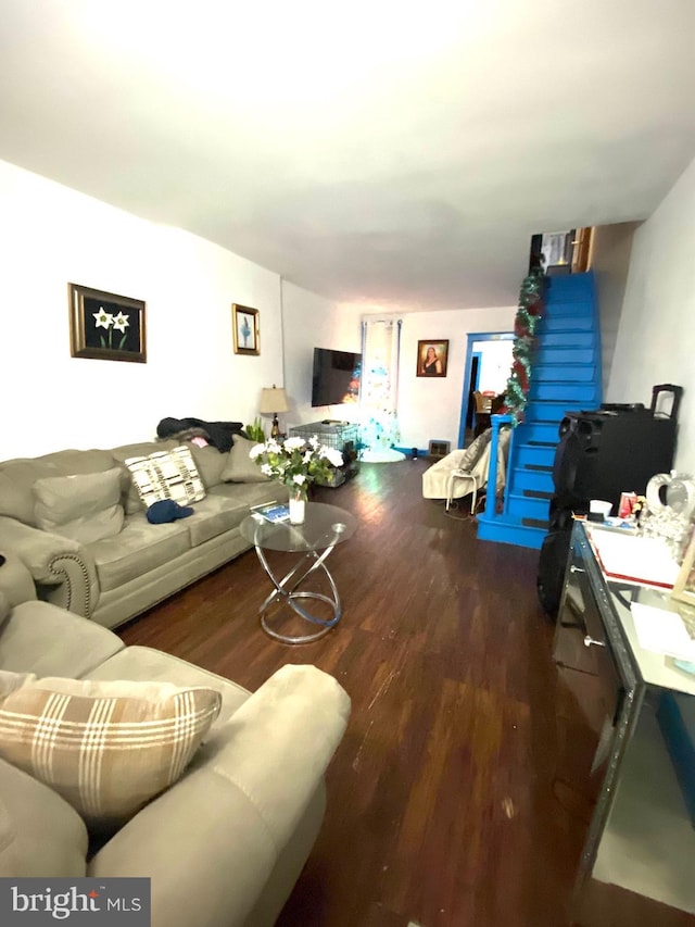 living room with dark hardwood / wood-style floors