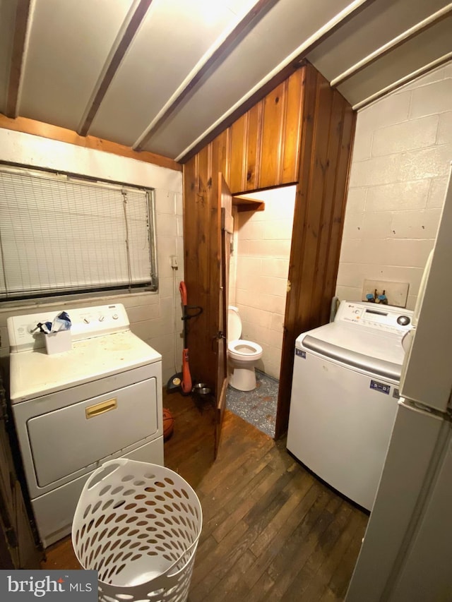 laundry area featuring dark wood-type flooring and washer / clothes dryer