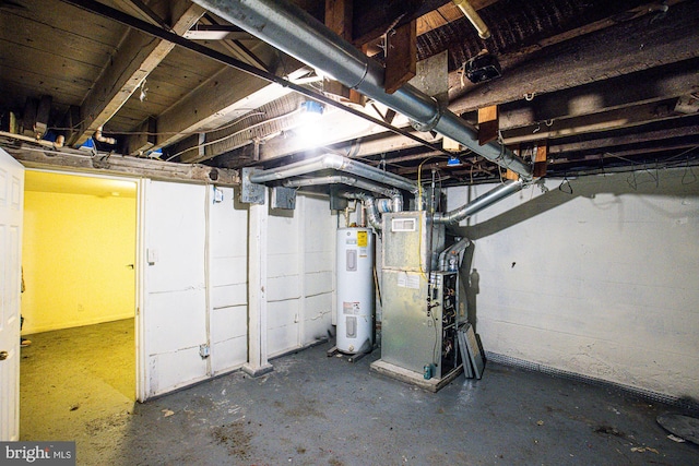 basement with heating unit and electric water heater