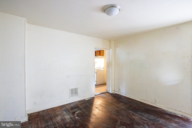 empty room featuring hardwood / wood-style flooring