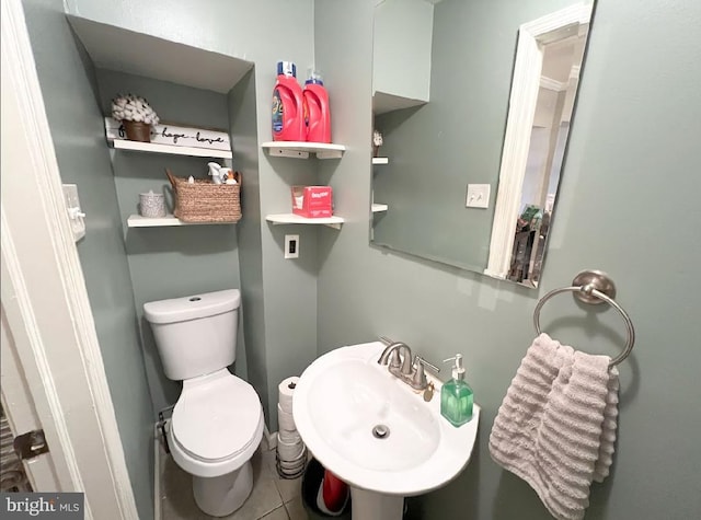 bathroom featuring tile patterned floors, sink, and toilet