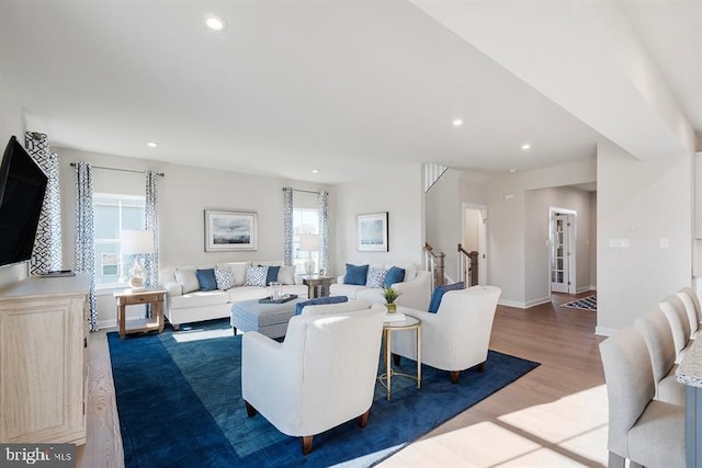 living room featuring hardwood / wood-style floors and a healthy amount of sunlight