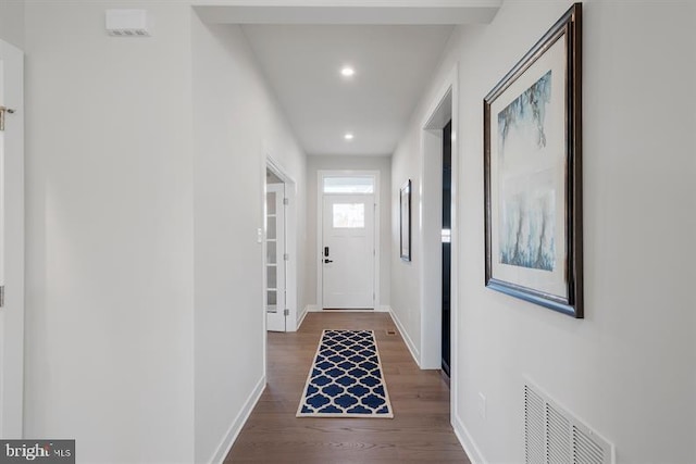 hall with dark hardwood / wood-style flooring