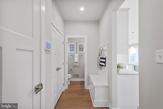 hallway featuring dark hardwood / wood-style floors