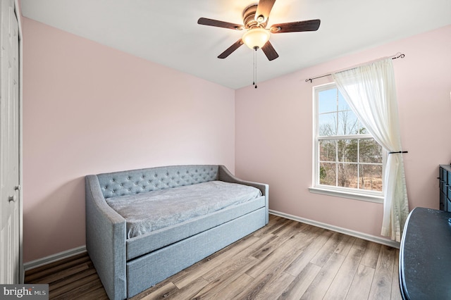 bedroom featuring ceiling fan and hardwood / wood-style flooring