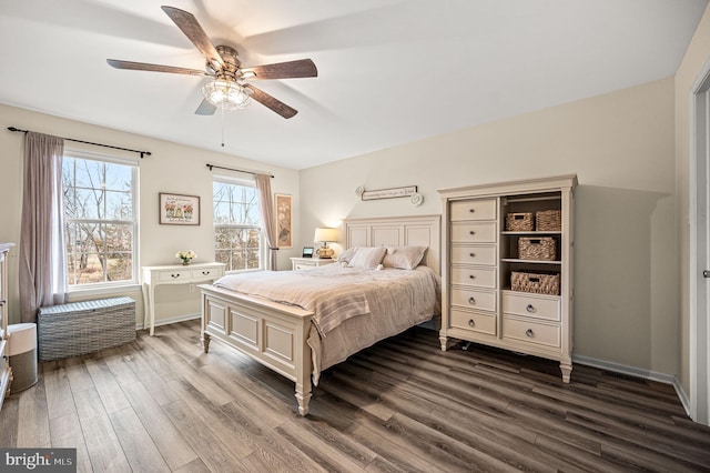 bedroom with ceiling fan and dark hardwood / wood-style flooring