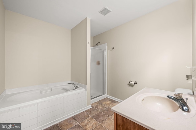 bathroom featuring separate shower and tub, tile patterned flooring, and vanity