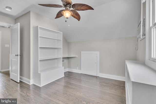 interior space with wood-type flooring, vaulted ceiling, and ceiling fan