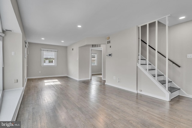 unfurnished living room with hardwood / wood-style flooring